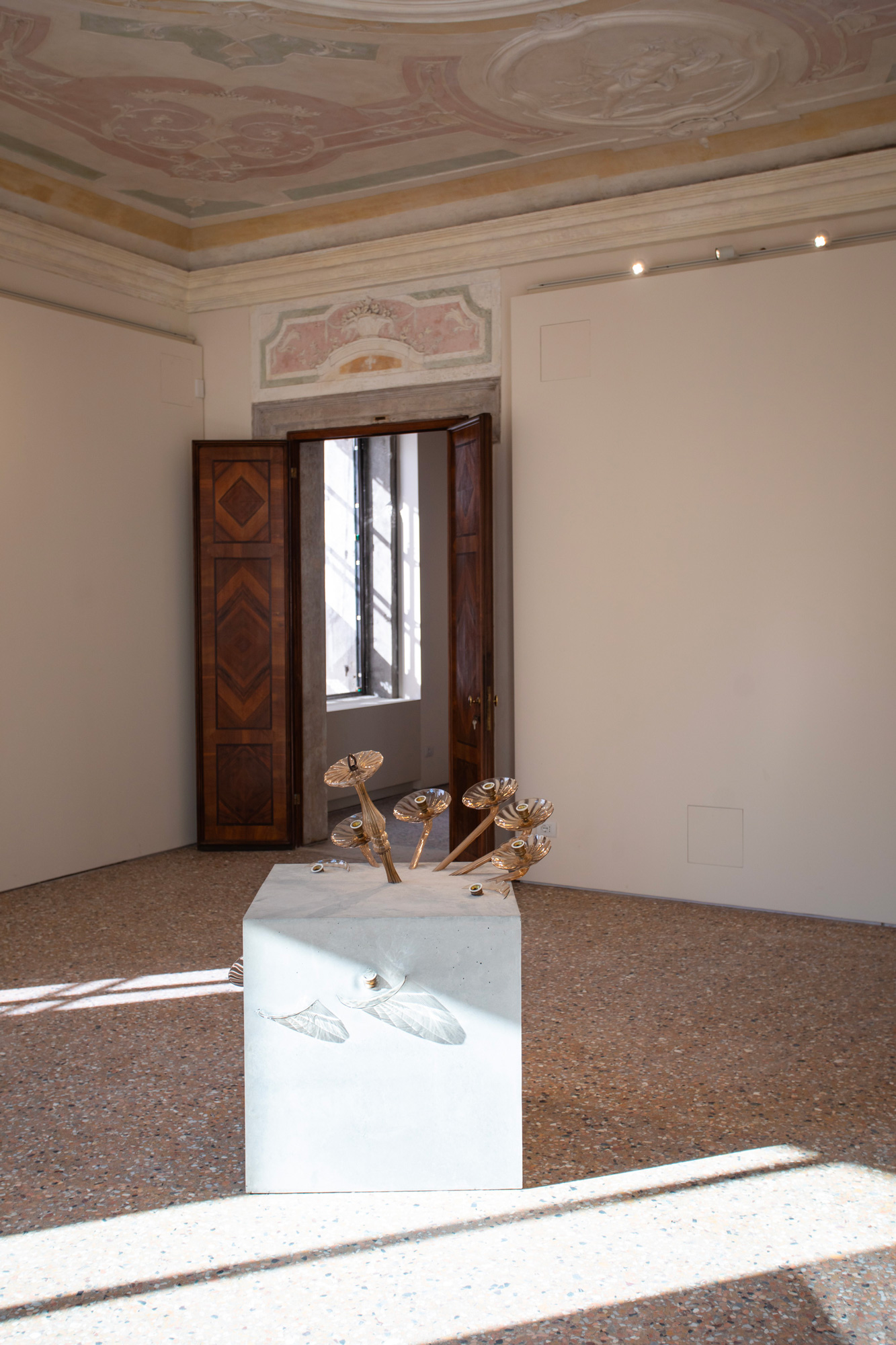 Piero Golia, Concrete cube with glass chandelier, 2024